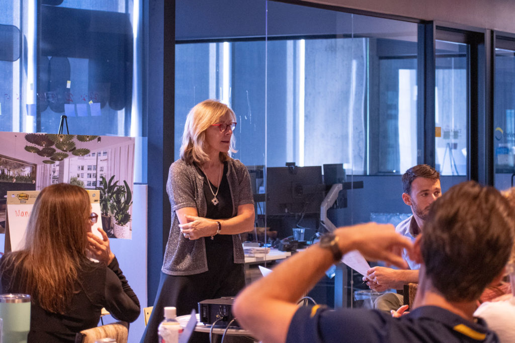 A facilitator during a debrief in the Creating Strategic Business Value program 